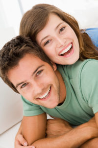 young teen couple smiling - Invisalign Teen